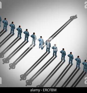 Different business thinking and independent thinker concept and new leadership concept or individuality as a group of people cast shadows with the shadow of one businessman going in the opposite direction as a business icon for innovative thinking. Stock Photo