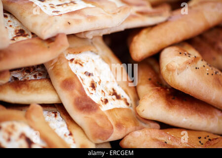 Market stall food displayed cooked breads with cheeses asian Stock Photo