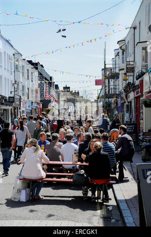 The bustling Gardner Street on a Saturday in North Laine area of Brighton with pavement bars pubs and cafes Stock Photo
