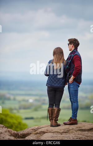 Young coupe on sandstone edge, view from Stormy Point over to the Pennines  trees The Edge at Alderley is a ridge of land separa Stock Photo