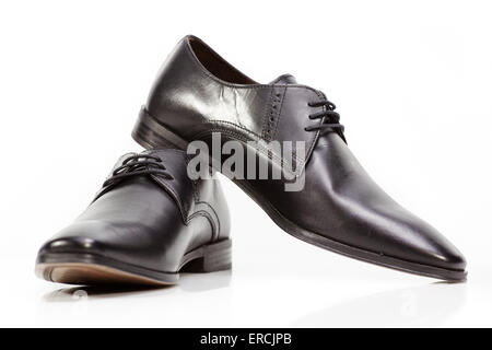 Male mans mens black leather shoes formal white background Stock Photo