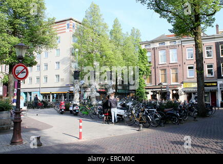 People  wining and dining on a summer evening at Gerard Douplein, de Pijp district, Amsterdam Stock Photo