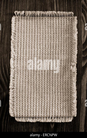 burlap hessian sack on wooden background Stock Photo