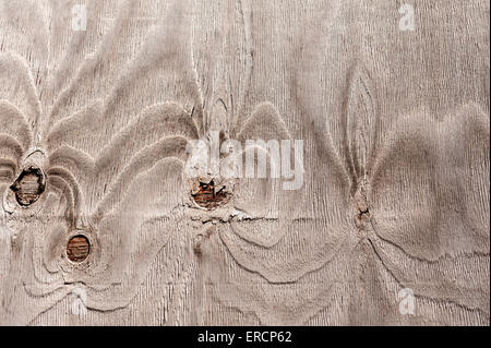 repeating pattern more obvious in sun bleached weathered pine shuttering ply exposed to elements wind rain sunshine Stock Photo