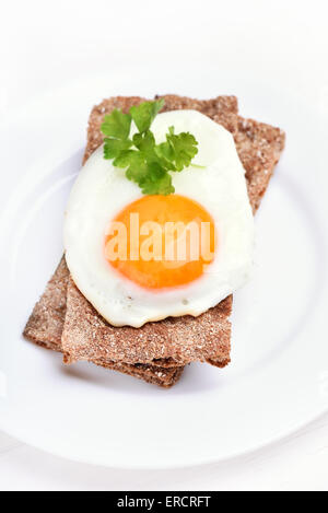 Fried egg on bread, top view Stock Photo