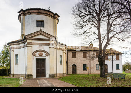 Facade of a XVIII century oratory, baroque church dedicated to an image of the Madonna from Loreto in the village of Passogatto near Ravenna in the countryside of Emilia Romagna in Northern Italy Stock Photo