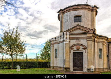 Facade of a XVIII century oratory, baroque church dedicated to an image of the Madonna from Loreto in the village of Passogatto near Ravenna in the countryside of Emilia Romagna in Northern Italy Stock Photo