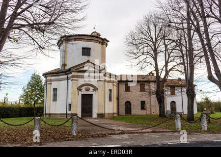 Facade of a XVIII century oratory, baroque church dedicated to an image of the Madonna from Loreto in the village of Passogatto near Ravenna in the countryside of Emilia Romagna in Northern Italy Stock Photo