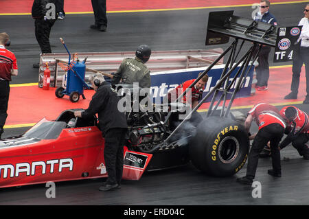 Checking over an FIA Top Fuel dragster at Santa Pod's FIA Main Event, May 2015 Stock Photo