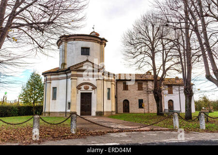 Facade of a XVIII century oratory, baroque church dedicated to an image of the Madonna from Loreto in the village of Passogatto near Ravenna in the countryside of Emilia Romagna in Northern Italy Stock Photo