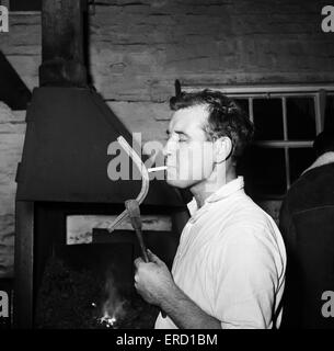 Pictures takes at stables at Newmarket, behind the scenes Horse shoe maker in the Newmarket forge. 3rd March 1964. Stock Photo