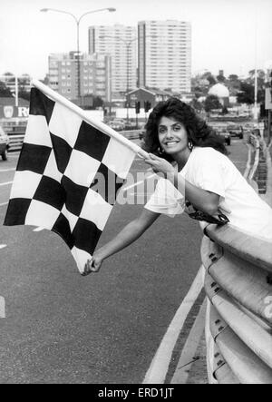 Maria Stevens, Beauty Queen, holding chequered flag at start of Halfords Birmingham Super Prix weekend, 29th August 1987. Stock Photo