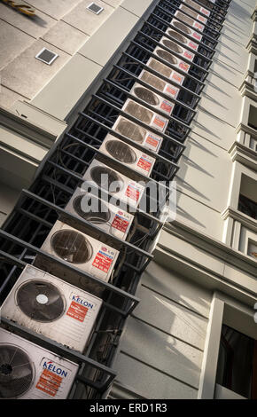 Multiple air conditioning units attached to the side of a modern hotel building in Sultanahmet, Istanbul, Turkey. Stock Photo