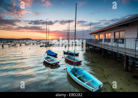 Boats at high tide at Sandbanks in Poole Harbour in Dorset Stock Photo