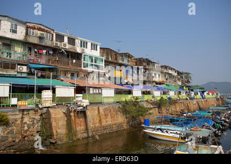 Crowded fishing village in Hong Kong HK. Lots of small craft fill the busy fishing port in a village in the new territories. Stock Photo