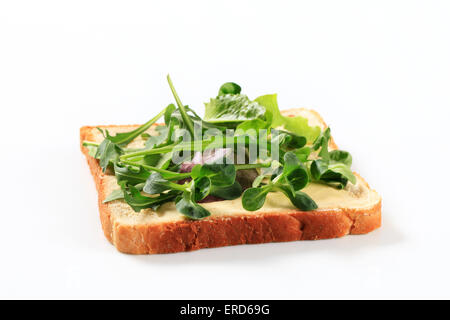 Slice of bread with mixed salad greens Stock Photo