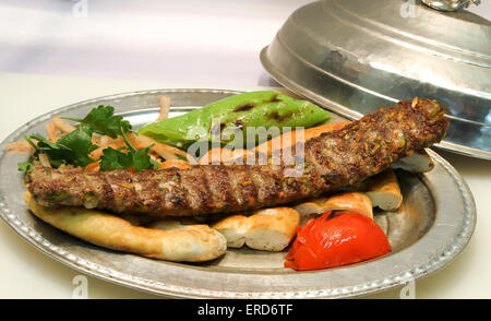 Turkish Kebab served in an anatolian plate. Stock Photo