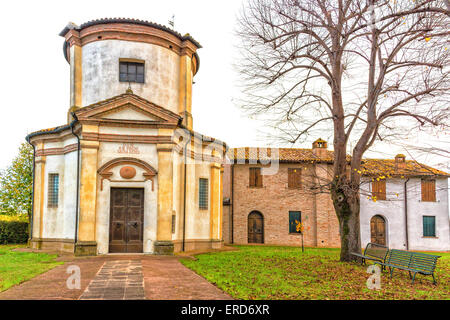 Facade of a XVIII century oratory, baroque church dedicated to an image of the Madonna from Loreto in the village of Passogatto near Ravenna in the countryside of Emilia Romagna in Northern Italy Stock Photo