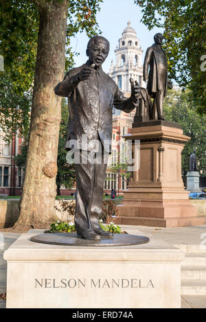 UK, England, London.  Nelson Mandela Statue, Parliament Square.  Sir Robert Peel in background. Stock Photo