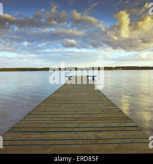 Wooden pier over the Nary lake in Poland  district of  Masuria Stock Photo
