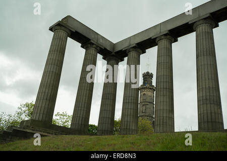 Nelson Monument seen through the columns of the unfinished National Monument of Scotland on Calton Hill - Edinburgh, Scotland Stock Photo