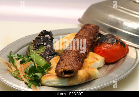 Turkish Kebab served in an anatolian plate. Stock Photo