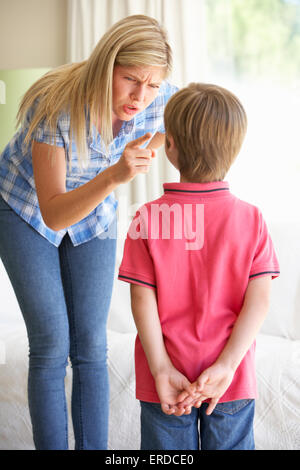 Mother Telling Off Son At Home Stock Photo - Alamy