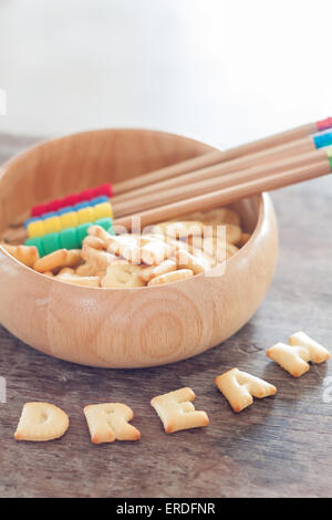 Dream alphabet biscuit on wooden table, stock photo Stock Photo