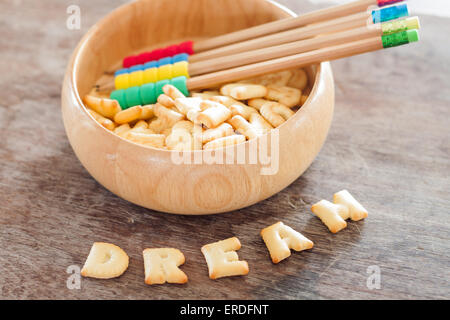 Dream alphabet biscuit on wooden table, stock photo Stock Photo