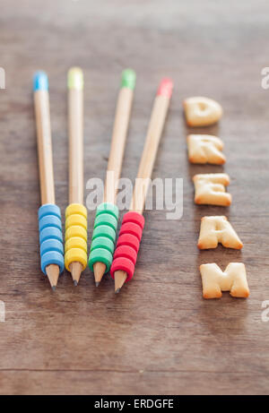 Dream alphabet biscuit on wooden table, stock photo Stock Photo