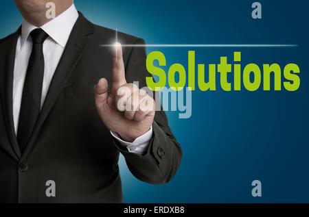 Solutions touchscreen is operated by businessman Stock Photo
