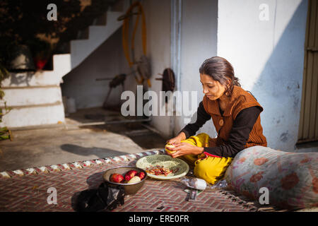 Woman preparing food outdoors Stock Photo