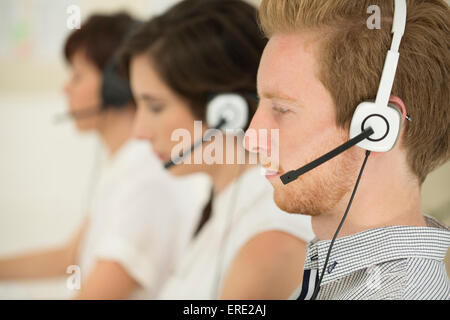 Close up of business people wearing headsets Stock Photo