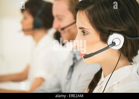 Close up of business people wearing headsets Stock Photo