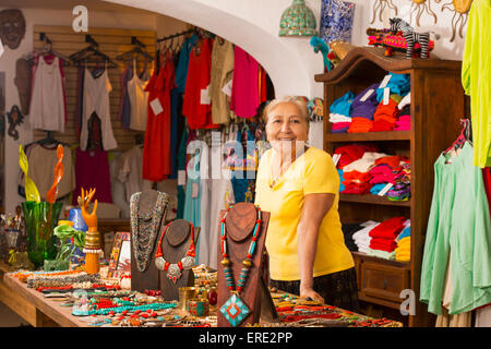 Smiling woman working in traditional gift shop Stock Photo