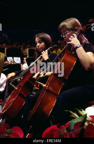 Cellists. Part of the cello section of a youth symphony orchestra, playing at the Royal Albert Hall, London as part of the Stock Photo