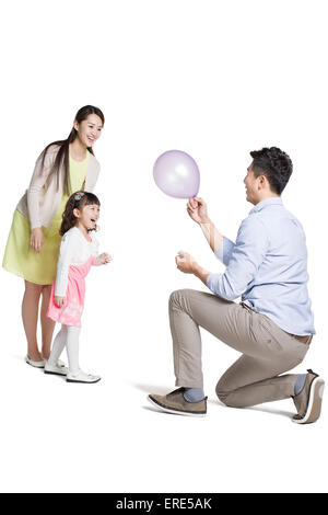 Happy young family with balloon