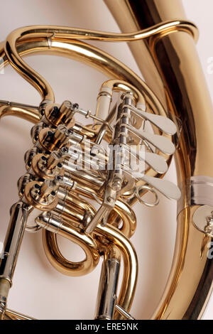 Wagner Tuba, valved brass instrument with conical bore. Detail of valves and tubing. Waldhorntuba. Ringtuba. Stock Photo