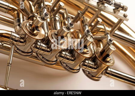 Wagner Tuba, valved brass instrument with conical bore. Detail of valves and tubing. Waldhorntuba. Ringtuba. Stock Photo