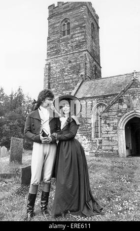 Robin Ellis as Ross Poldark and Angharad Rees as Demelza outside St Winnows church near Lostwithiel, Cornwall during the filming of Poldark in May 1977. Stock Photo