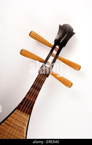 Chinese Pipa, close-up of the tuning pegs, or short-necked lute, tradtional instrument of china made with shallow piriform body, wooden soundboard and frets and four strings tuned to E, A, B, E. Stock Photo