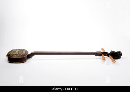 San Hsien or Sanxian, 3 stringed chinese lute. Python skin covered resonating or resonator box and Dragons-head scroll. Hsien Stock Photo