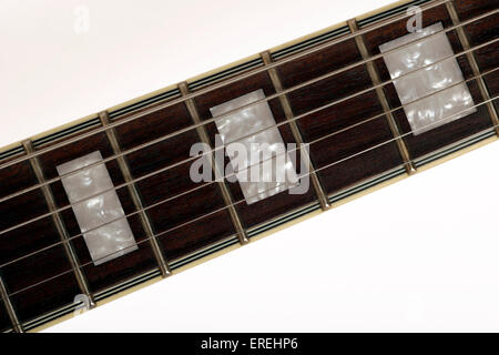 Guitar neck with mother of pearl inlay, generic, showing detail of strings and fingerboard Stock Photo