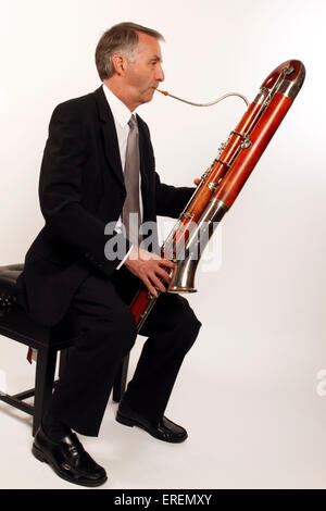 Contra Bassoon player in playing position Stock Photo