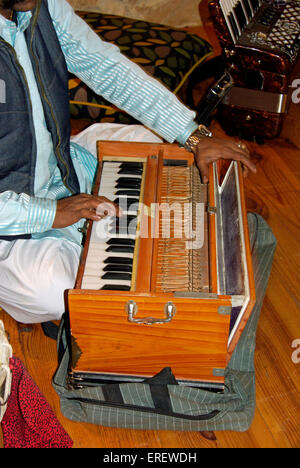 Close-up of Indian harmonium player's hands. Also known as peti or baja Stock Photo