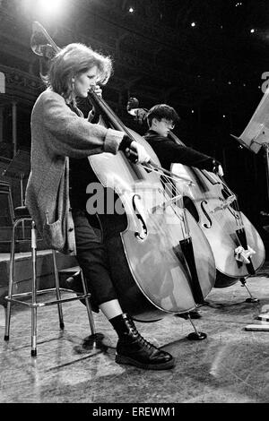 Two young double-bass players in rehearsal for one of the Schools Prom concerts at the Royal Albert Hall, London. Stock Photo