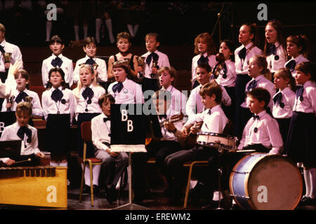 Young musical ensemble playing various instruments and singing during one of the Schools Prom concerts at the Royal Albert Hall, London. Stock Photo