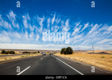 Strange wispy finger like clouds over San Luis Reservoir along Highway 152 Near Los Banos California Stock Photo