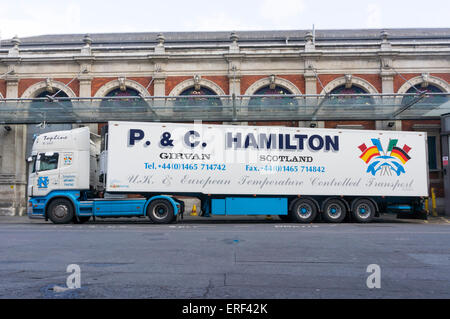 Large refrigerated transporter from P & C Hamilton of Girvan, parked in a loading bay at Smithfield Market. Stock Photo