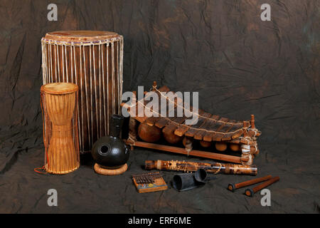A collection of African musical instrument. Back row left to right - Doum Doum drum, African Marimba or Balafon, Front row - Stock Photo